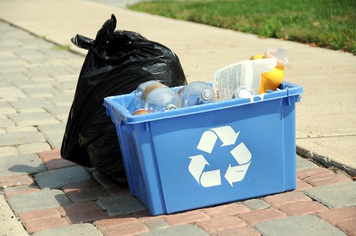 Bags and boxes of separated recyclables ready for transfer at a local recycling point